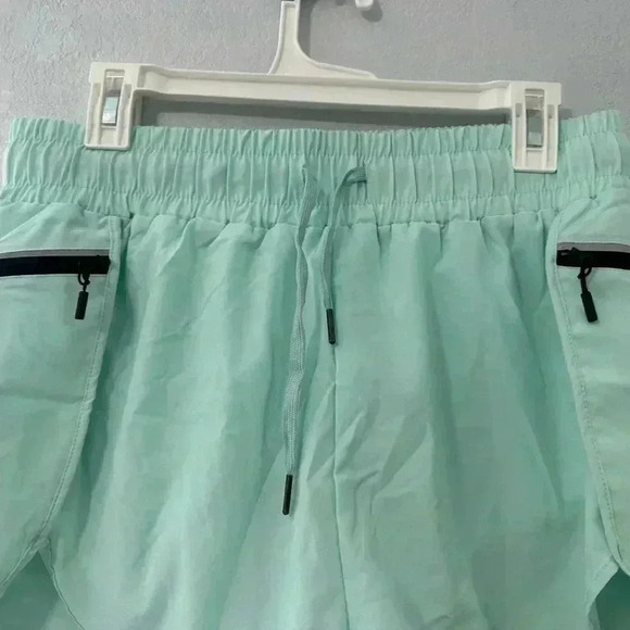 117. Oalka Women's Quick Dry Running Shorts Lined Workout Shorts with Pocket - Picture 5 of 6